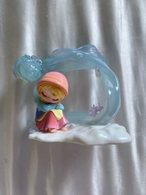 Pastel Sleeping Girl Figurine with Blue Wave Accent